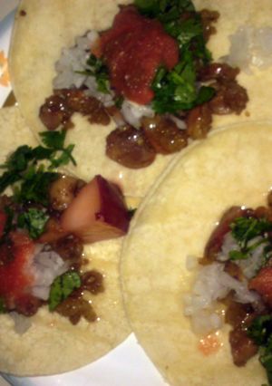 A picture of how to prepare and cook beef intestines for tacos.