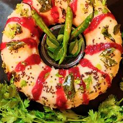 Snow white Dhokla with mustard tempering A picture of Snow white Dhokla with mustard tempering.