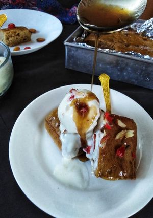 A picture of Dates pudding with toffee sauce.