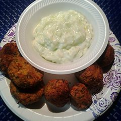 A picture of Falafels and cucumber yogyurt sauce.