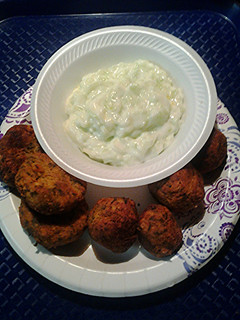 A picture of Falafels and cucumber yogyurt sauce.