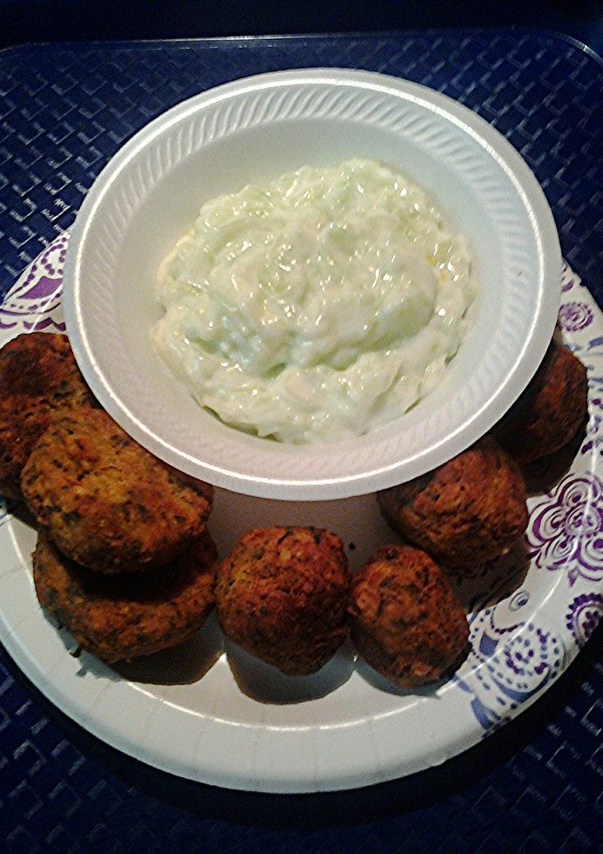 A picture of Falafels and cucumber yogyurt sauce.