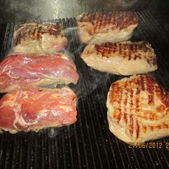 A picture of Beef steak grilling.