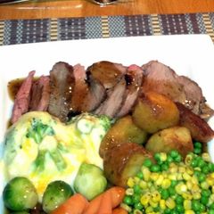 A picture of Roast lamb with Rosemary and Garlic.