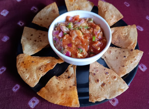 A picture of Leftover roti nachos with viral tomato chutney (tomato salsa).