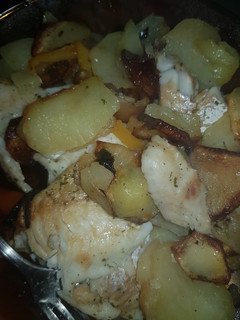 Una foto de Merluza al horno con patatas