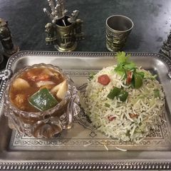 A picture of Chicken Shashlik with egg fried rice.