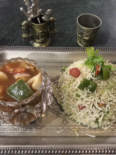 A picture of Chicken Shashlik with egg fried rice.