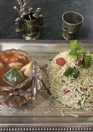 A picture of Chicken Shashlik with egg fried rice.