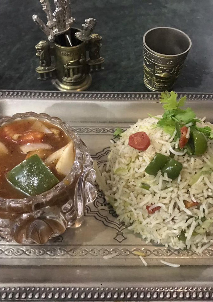 A picture of Chicken Shashlik with egg fried rice.