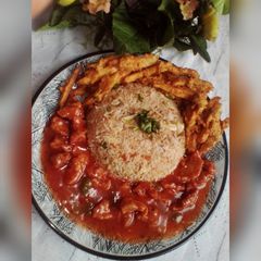 A picture of Chicken Manchurian with Egg Fried Veggies Rice & Crispy fries.