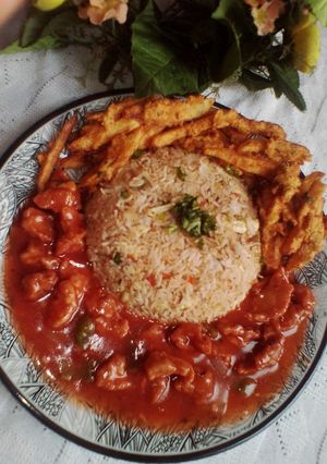 A picture of Chicken Manchurian with Egg Fried Veggies Rice & Crispy fries.