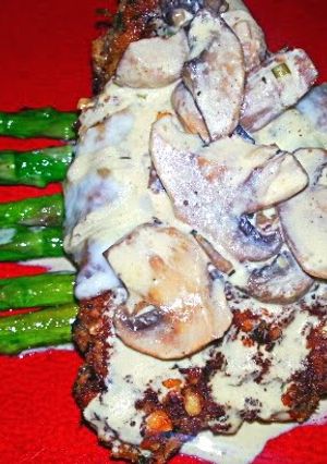 A picture of Walnut Crusted Chicken with Mustard Mushroom Creme Sauce.