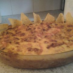 A picture of Mexican Cheesey Chilli Beef with Doritos.