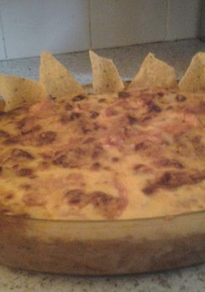 A picture of Mexican Cheesey Chilli Beef with Doritos.
