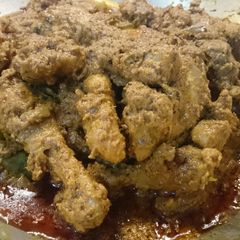 A picture of Spicy asian chicken rendang.