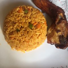 A picture of Party jollof rice and fried chicken.