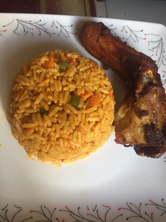 A picture of Party jollof rice and fried chicken.