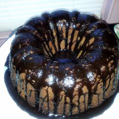 A picture of Peanut Butter Cake with Chocolate Ganache Icing.
