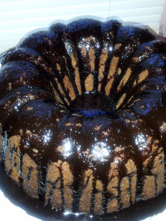 A picture of Peanut Butter Cake with Chocolate Ganache Icing.