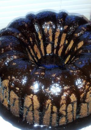 A picture of Peanut Butter Cake with Chocolate Ganache Icing.