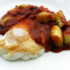 Fried Eggs With Leeks Top Bolognese Sauce A picture of Fried Eggs With Leeks Top Bolognese Sauce.