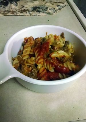 A picture of Baked rotini with meat sauce.