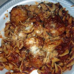 egg noodles with sauce and chicken meatballs A picture of egg noodles with sauce and chicken meatballs.