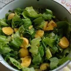 A picture of Lettuce salad with eggs.