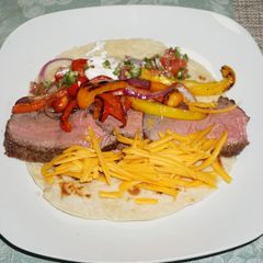 A picture of FAJITAS WITH GRILLED BEEF AND PEPPERS. JON STYLE.