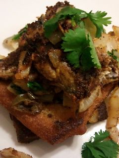 A picture of Sardines on fried toast.