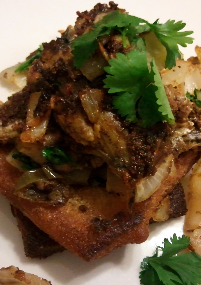 A picture of Sardines on fried toast.