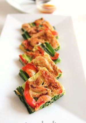 A picture of Pajeon (Korean Style Piccata) with Scallion and Sakura Shrimp.