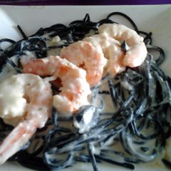 A picture of Gambas with black Spaghetti.