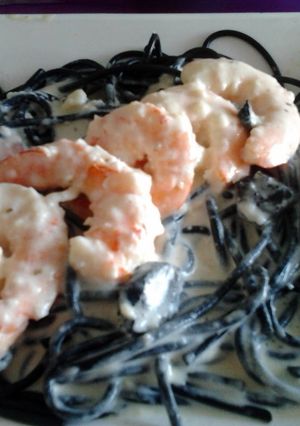 A picture of Gambas with black Spaghetti.