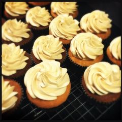A picture of White Chocolate Cupcake with Peanut Butter frosting.