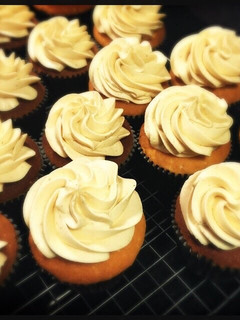 A picture of White Chocolate Cupcake with Peanut Butter frosting.