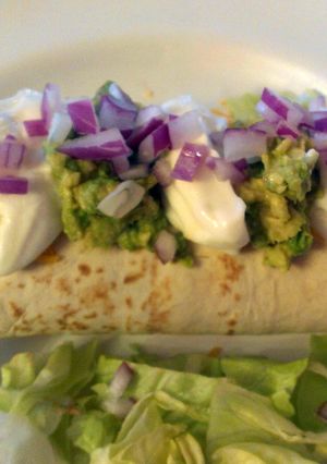 A picture of Baked chicken chimichangas.