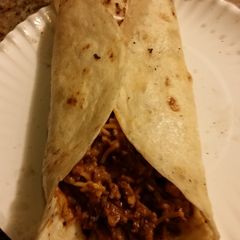 A picture of Cheesy Rice and beef burrito.