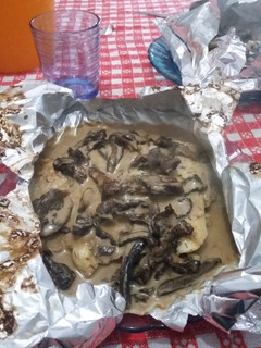 A picture of Filet of Fish Papillote with Pine Mushroom Sauce.