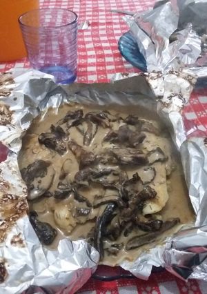 A picture of Filet of Fish Papillote with Pine Mushroom Sauce.