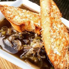 A picture of French Onion Soup with Parmesan/Cheddar Croutons.