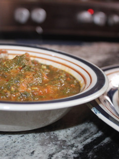 A picture of Pounded yam with vegetable soup.