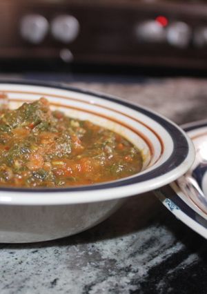 A picture of Pounded yam with vegetable soup.