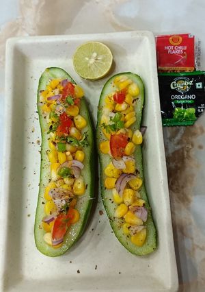 A picture of Sweet corn chat in cucumber boat.