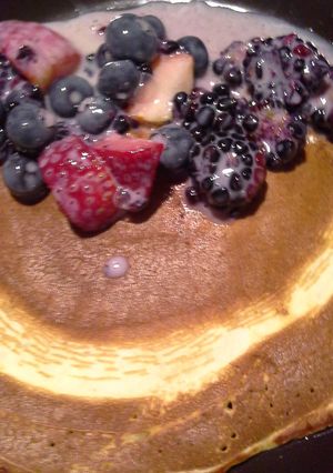 A picture of Pancakes with fruits.