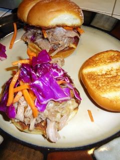 A picture of Crock pot pulled pork BBQ with red cabbage slaw.
