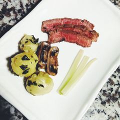 A picture of Southern Steak and red potatoes.