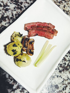 A picture of Southern Steak and red potatoes.