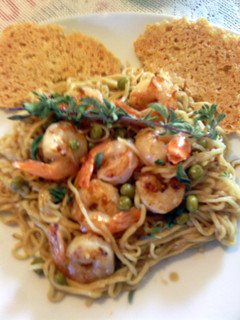 A picture of angel hair with shrimp.